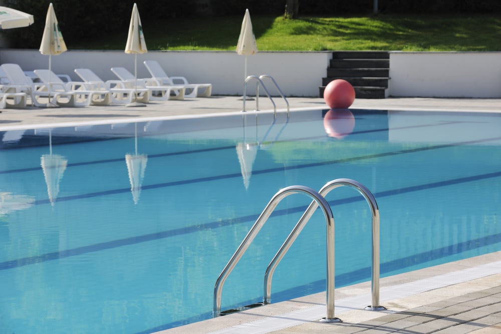 blue water with reflection at hotel resort swimming pool outdoor at sunny day